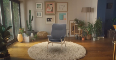 A chair can be seen in a living room using AR